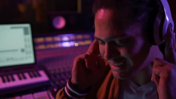 Male sound engineer working at a mixing desk