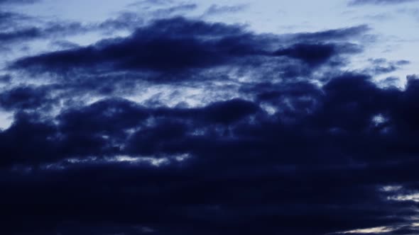 Silhouettes of Picturesque Dark Blue Clouds in Evening Sky