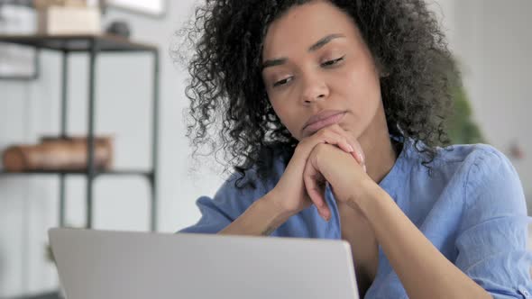 Close Up of Pensive African Woman Thinking at Work