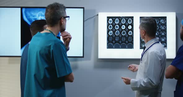 Doctors Discussing MRI Scan Results