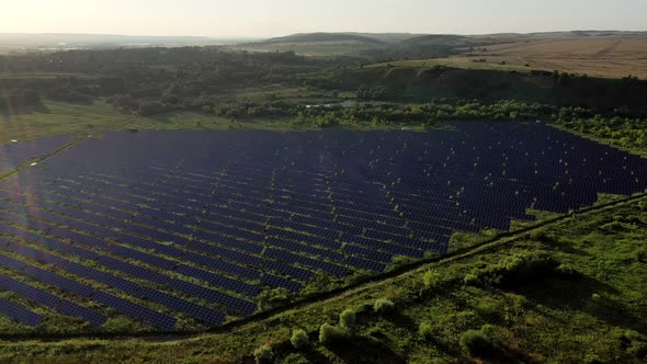 Ecology solar power station panels in the fields green energy at sunset landscape
