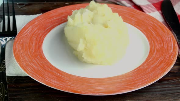 Mashed Potatoes Put on Plate Poured Over with Mushroom Sauce and Put on Top Fried Eggs Closeup