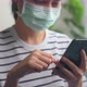 woman wear masks to protect disease and using smartphone, During leisure time. - VideoHive Item for Sale