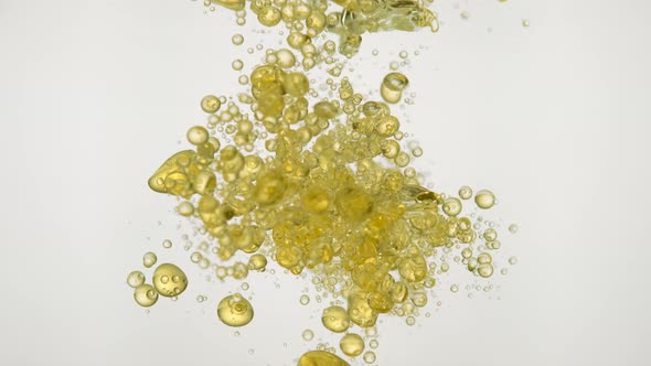 Pouring oil into water. Slow Motion. alt