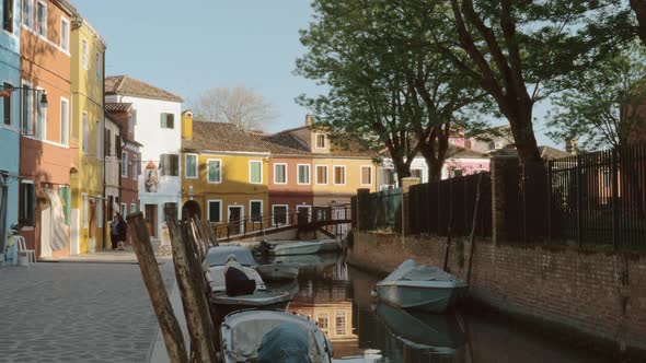 Canal with Boats and Coloured Houses in Burano Island, Italy