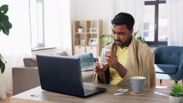 Ill Man with Medicines Having Video Call on Laptop