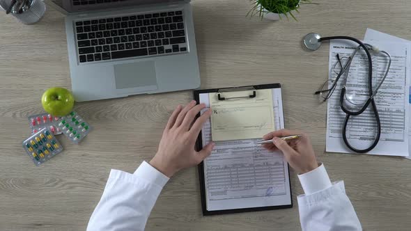 Family Doctor Signing Prescription and Health Insurance Form, Health Care Reform