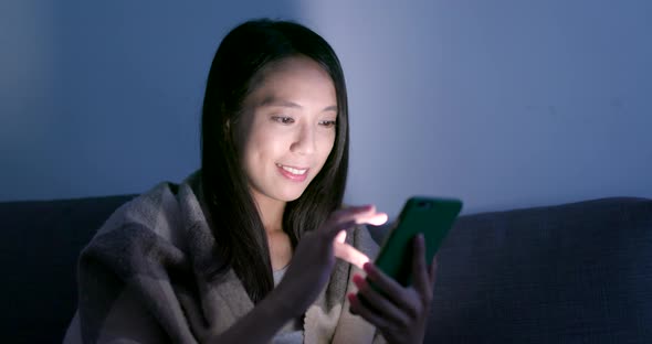 Woman Use of Smart Phone on Bed at Night