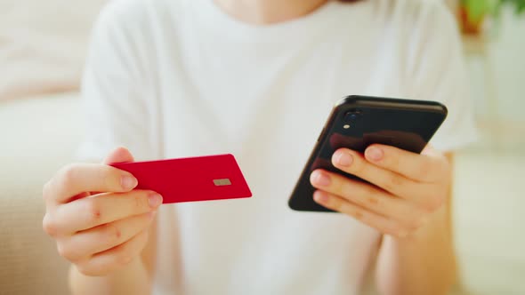 Woman Using Credit Card and Smartphone Shopping in App