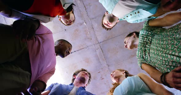 Group of business executives forming hands stack