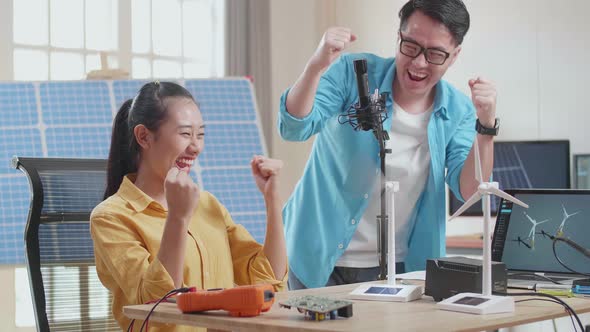 Asian Man And Woman Being Happy Succeed Testing The Wind Turbine While Working