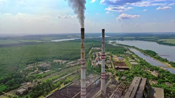 Factory with smoke stack. Factory pollutes the atmosphere harmful emissions