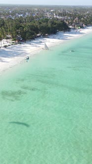 Tanzania  Vertical Video Kitesurfing Near the Shore of Zanzibar Slow Motion