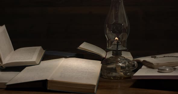 Old books and kerosene lamp