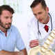 Patient Listening To Doctor Explain Spine Model - VideoHive Item for Sale