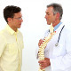 Doctor Holding Model Of Spine Talking To Patient - VideoHive Item for Sale