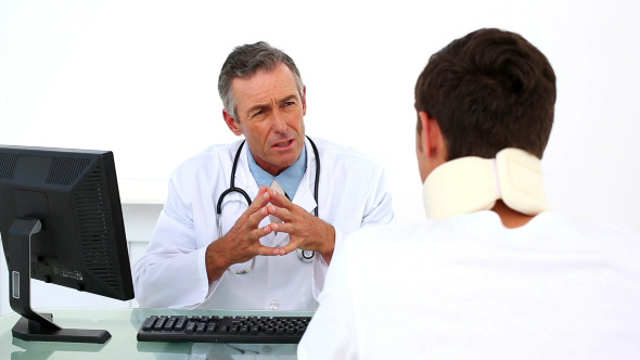 Patient In Neck Brace Listening To His Doctor alt