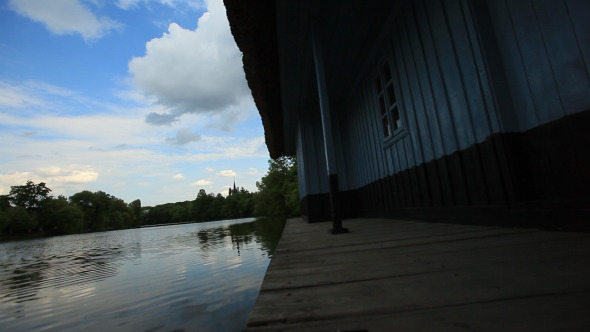 Lake Water Near Rustic Traditional House