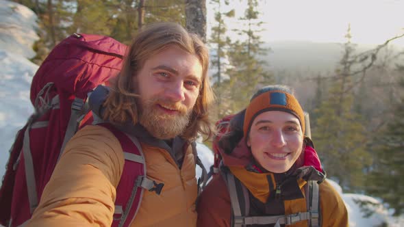 POV of Happy Tourists Taking Selfie on Snowy Mountain