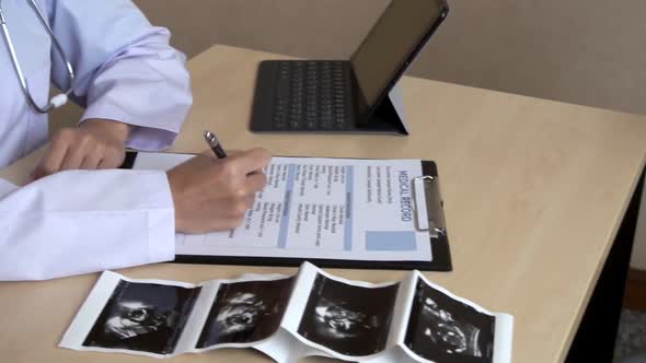 Pregnant Woman and Gynecologist Doctor at Hospital