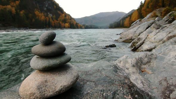 Pyramid Of Stones On The Mountain River 
