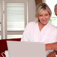 Happy Couple Using Laptop Together In Bathrobes - VideoHive Item for Sale