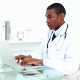 Serious Doctor Working On His Laptop - VideoHive Item for Sale