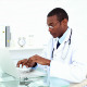 Concentrating Doctor Working On His Laptop - VideoHive Item for Sale