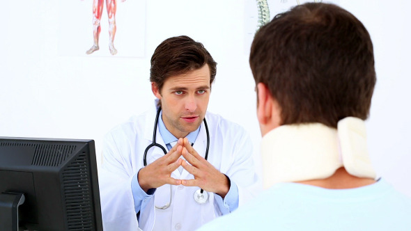 Doctor Speaking To Patient With A Neck Injury