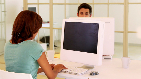 Casual Business Team Working On Computers