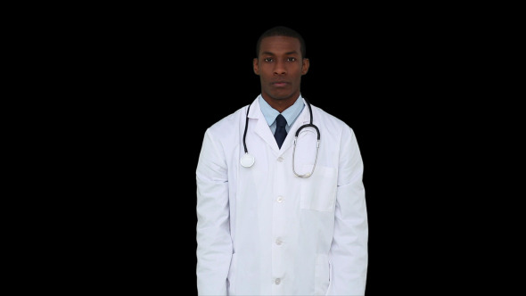 Serious Young Doctor Showing Tablets To Camera 1