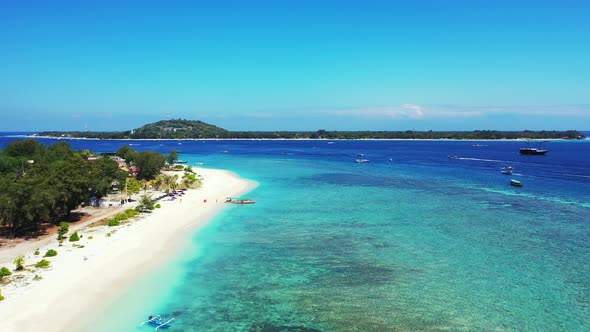 Tropical drone island view of a summer white paradise sand beach and turquoise sea background