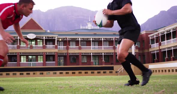 Male rugby players playing rugby in the stadium 4k