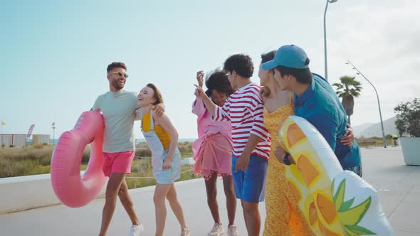 Group of friends having fun on the beach.