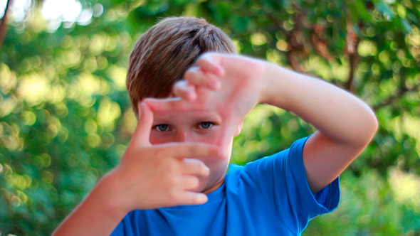 Pretty Boy Creating A Frame With Fingers