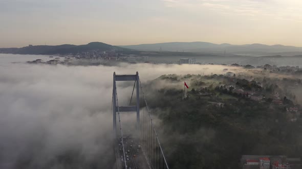 aerial video of Fatih Sultan Mehmet Bridge on a foggy day in Istanbul, Turkey.