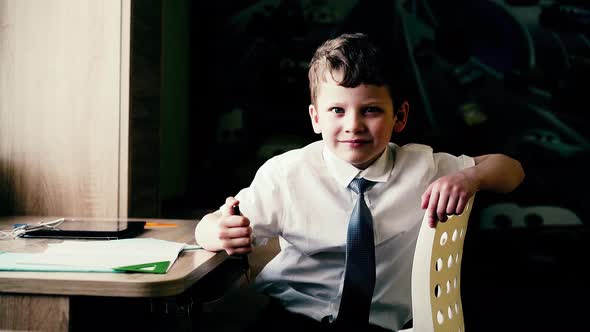 CU Portrait of Boy Who is Preparing to Go to School He Smiles