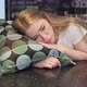 Girl Sleeping on the Table with a Pillow While Waiting for the Morning Teleconference - VideoHive Item for Sale