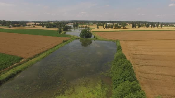 Drone fly ove the lake and fields. High quality 