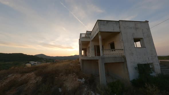 Drone Through Abandoned Building Towards Village In Corfu