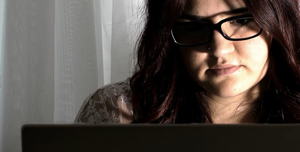 Young Girl Working on Computer Notebook alt