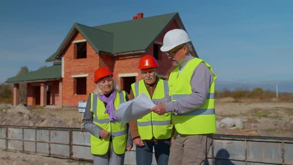 Real Estate Agent Manager Architect Showing Modern House to Senior Grandparents Family Client Couple