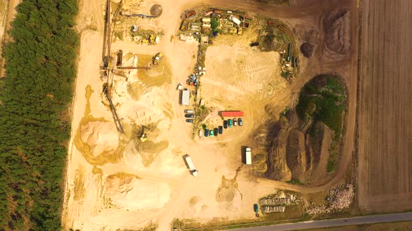 Aerial view of sandpit and factory plant producing sand materials for construction industry. Top vie