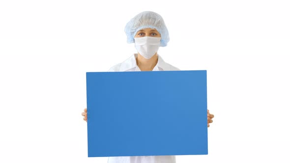 Woman Doctor in a Mask Holding an Empty Board on White Background.