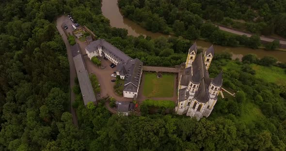 Drone Flight above German Monastery. View on river below.