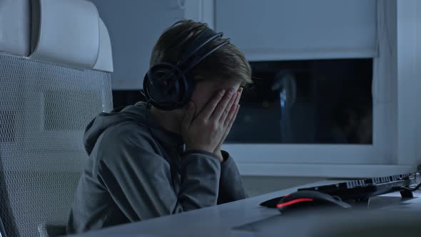 Excited Gamer Playing and Winning in Online Video Game on His Personal Computer