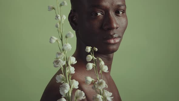 African American Man With White Flowers