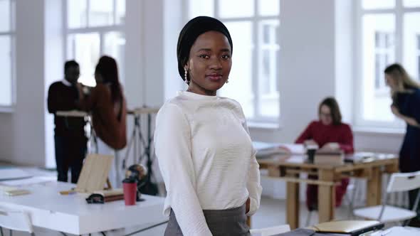 Happy Professional Young African Business Woman in Formal Clothes and Turban Posing, Smiling at