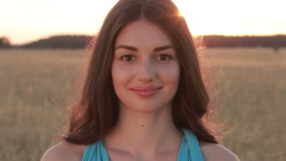 Summer Portrait of Charming Woman at Sunset