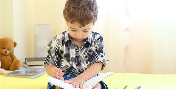 Little Boy Drawing His Hand